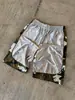 Shorts modernos de estilo callejero, shorts de camuflaje brillantes con retazos de alta calle americana con cordón, cintura elástica y bordado, shorts deportivos de longitud media