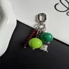 Colgante de cuentas redondas de color block único y creativo, color macarrón, llavero minimalista y charm para bolso - estilo nuevo