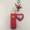 Bolsa de Batom Popular Portátil Transfronteiriça Chaveiro com Pingente de Couro Acessório Bolsa de Armazenamento de Batom Mini Espelho em Forma de Coração