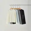 Camiseta base minimalista versátil de lana con cuello redondo para mujer, nueva básica otoño 2026 de ajuste ceñido con hombros rectos y mangas largas