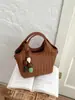 Bolso de cubo de un solo hombro para mujer, cruzado, nicho, tejido, nueva moda 2026, bolso de mano versátil, bolso súper nicho