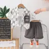 Ropa para Niños Verano Traje de Caballero para Niños Camisa con Solapa Estampado de Dinosaurio Pantalones Cortos Conjunto de Dos Piezas Fabricante de Origen Venta al por Mayor