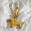 Al por mayor En stock Colgante de Perro Dachshund Accesorios Pequeños de Cuero Encantos Lindos de Dibujos Animados para Bolsos Llavero de Cuero de Dibujos Animados