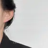 Un Pendiente Versátil de Cadena Larga con Borla con un Ambiente Elegante y de Diosa, Diseñado para Hacer que el Rostro Parezca Más Pequeño, Presentando un Diseño Hueco en Forma de Corazón