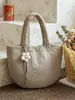 Nueva colección Otoño/Invierno 2026: Bolso de mano minimalista de color liso para mujer, bolso tote pequeño, adecuado para el trabajo y los desplazamientos, bolso acolchado de algodón estilo coreano