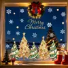 Vários adesivos coloridos de Natal com tema natalino para janelas, com desenhos de árvores de Natal e flocos de neve, para decorar vitrines de lojas e portas de vidro.; adesivos de janela eletrostáticos