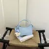 Bolsa transversal de ombro único com textura casual, moda, personalidade simples, bolsa nova 2026 Primavera, bolsa quadrada pequena feminina estilosa