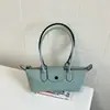 Bolso tote de estilo francés con nicho y asa larga, nuevo diseño de moda, bolso baguette de alta calidad, moderno y versátil, perfecto para llevar debajo del brazo