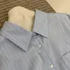 Camisa de Rayas Verticales con Bordado de Bolsillo Estilo Coreano Nueva para Primavera para Mujer, Blusa Elegante y Casual de Corte Holgado para el Trabajo y el Ocio, Transfronteriza