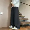 Calças de moletom simples de cor sólida com cintura elástica para homens, calças esportivas largas versáteis da moda, calças casuais confortáveis de perna reta