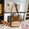 Bolsa transversal fofa para mulheres, estilo coreano, design de nicho, moderna, macia e adorável, pequena mochila, design de desenho animado, perfeita para passeios