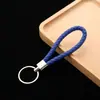 Llavero de cuerda de cuero colgante para coche accesorios cuerda de llave de cuerda de cuero tejido pu para empujar pequeño regalo fabricantes al por mayor