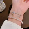 Pulsera de Perlas de Doble Capa Llave Mágica Nuevo Estilo de Primavera Lujo Ligero Gama Alta Versátil Accesorio para la Mano Pulsera Exquisita y Elegante