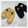 Pantalones deportivos casuales unisex con estampado de estrellas, ropa infantil estilo coreano, diseño versátil, colección otoño 2026, pantalones de moda a la altura del tobillo para niños pequeños y mayores