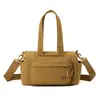 2026 Nova Tendência Fashion Versátil Grande Capacidade Feminina Casual Leve Bolsa de Nylon Bolsa para Viagem Curta Bolsa Almofada