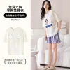 Conjunto de pijama de algodón para mujer de verano en stock con mangas cortas, shorts, copas en el pecho, cuello redondo, diseño lindo de caricatura, ropa casual para el hogar