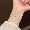 Artículo Popular de Venta Caliente: Collar Circular con Cruz Tachonada de Moissanita en Dos Tonos, Elegante y Versátil, Cadena Elegante para la Clavícula Hecha de Plata S925