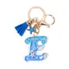 Llavero Colgante Temático Océano Azul con Borla de Estrella de Mar, Llavero de Resina Encanto para Bolso con 26 Letras