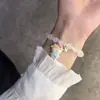Nueva pulsera de esmalte de mariposa femenina ins nicho lujo ligero Mori azul marino cuentas de colores craqueladas hielo pulsera de amigas al por mayor