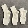 Calcetines antibacterianos de 10A de longitud media y corta para hombre y mujer, con suelas de masaje, color liso, transpirables, resistentes al olor, absorbentes de sudor, calcetines deportivos casuales para todas las estaciones