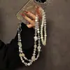 Correa cruzada de alta gama original con perlas de estrella, cristal, mariposa, cadena para teléfono, cadena de bolso universal, estilo nuevo de moda