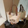 Bolsas pequenas populares de comércio exterior 2026 verão novas estilosas da moda bolsas de mão com estampa de letras bolsas tote casuais