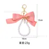 Chaveiro Fofo de Laço de Fita de Cetim com Corrente de Pérolas Pingente de Laço de Metal Pingente de Bolsa Decoração Venda Quente Transfronteiriça