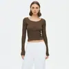 Camiseta de punto acanalado de cuello redondo con botones en el hombro recto, moda 2025 para mujer, color liso, top versátil de manga larga para ir al trabajo