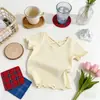 Camiseta Corta de Manga Corta con Espalda Cruzada de Moda para Niñas 2026 Verano Nuevo Estilo Coreano Color Sólido Versátil Casual para Niños
