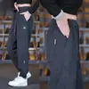 Pantalones de punto de sarga 2026 nuevo estilo para personas de mediana edad y jóvenes holgados versátiles deportivos tipo harén con puño casual pantalones largos para hombre