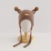 Gorro de peluche con orejeras de oso de dibujos animados para niños, gorro cálido de oso 3D para otoño e invierno con cordones, gorro unisex a prueba de frío