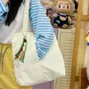 Bolsa de ombro de lona de grande capacidade para mulheres, novo modelo 2026, adequada para trabalho e deslocamento, bolsa tote estilo coreano, bolsa de lona