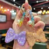 Llavero de Moño Elegante y de Alta Gama Incrustado con Diamantes y Exquisitas Cuentas de Cristal de Colores, un Accesorio Decorativo para Bolsos de Mujer