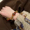 Transfronterizo europeo y americano nuevo estilo navideño dulce lindo combinable esmalte de imitación muñeco de nieve hombrecillo de azúcar pulsera de cuentas roja verde