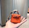 H Moda Couro Genuíno Mini Bolsa Pequena Bolsa Kelly Pingente Bonito Bolsa para Fone de Ouvido Feminina Bolsa de Armazenamento Pingente de Chaveiro