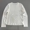 Diseño cosido, suave y cómodo, estilo casual y relajado, camiseta de manga larga para mujer, cuello redondo, color liso, versátil, adelgazante y se puede usar como capa base