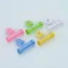 Exprimidor de pasta de dientes de caramelo creativo compañero de lavado y cepillado de dientes lava con gancho de ventosa exprimidor de pasta de dientes enrollable