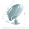 Caja de jabón creativa con forma de hoja sin perforaciones de pie ventosa sin estancamiento caja de artefacto de jabón para el hogar en stock al por mayor