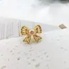 Pendientes de Botón Exquisitos Versátiles de Temperamento con Perlas y Lazo Hueco de Doble Capa Moda Estilo Minimalista Simple Nicho