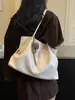 Bolso de axila retro de alta gama de gran capacidad para mujer, nuevo bolso de hombro de moda 2026 para commuting, bolso de mano tipo tote, moderno