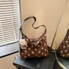 Bolso de lunares de alta gama, moda nicho transfronteriza de otoño, bolso exquisito para salir para mujer, bolso versátil de gran capacidad para hombro y cruzado