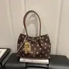 Nuevo bolso de hombro y bolso de mano de estilo coreano de moda de alta costura de alta capacidad con lunares, otoño temprano de 2026