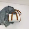 Moda Nova Primavera 2026 Estilo Coreano Ins Grande Capacidade Portátil Lona Roupas de Trabalho Bloqueio de Cores Bolsa Tote Casual de Ombro Único