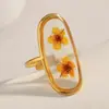 Europa y Estados Unidos venta caliente transfronteriza temperamento alto nivel nicho joyería acero inoxidable chapado en oro de 18K acrílico seco anillo abierto