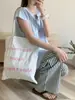 Bolso de mano con estampado simple y versátil, estilo femenino y suave, bolso de hombro de gran capacidad estilo coreano para estudiantes que van a clase