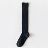 Calcetines de mujer primavera y otoño nuevos calcetines de algodón de tubo largo verticales en blanco y negro gris calcetines apilados calcetines simples calcetines de pantorrilla