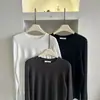 Camiseta de tirantes de la nueva colección otoño/invierno de Dongdaemun, Corea, de color liso, versátil, corte ajustado, manga larga, capa base para mujer