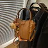 Bolso de cesta de mujer de moda 2026 modelo nuevo, bolso de hombro cruzado elegante y con estilo, bolso tipo cubo texturizado de mano