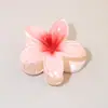 Horquilla con forma de huevo y diseño de flor en degradado, ideal para viajes, vacaciones y playa, muy vendida en Amazon.