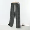 Nuevos pantalones de cuadros para otoño e invierno para mujer, con cintura elástica estilo americano, forro de felpa doblemente cepillado y diseño de pierna ancha, perfectos para uso casual.
